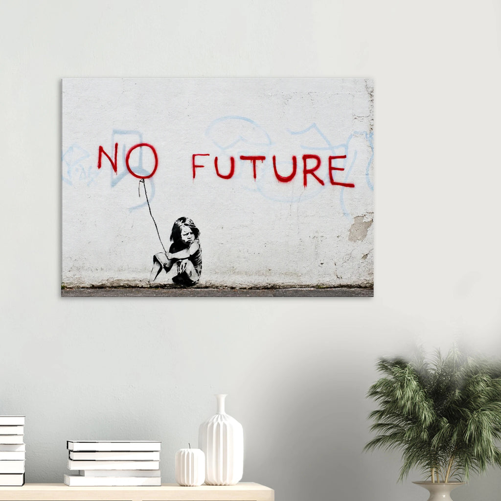 Banksy No Future canvas hanging above a white console with a green plant in a bright minimalist room