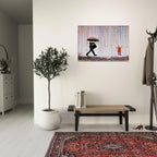 Banksy Rainbow Rain canvas above a grey sofa in a modern living room with a patterned rug